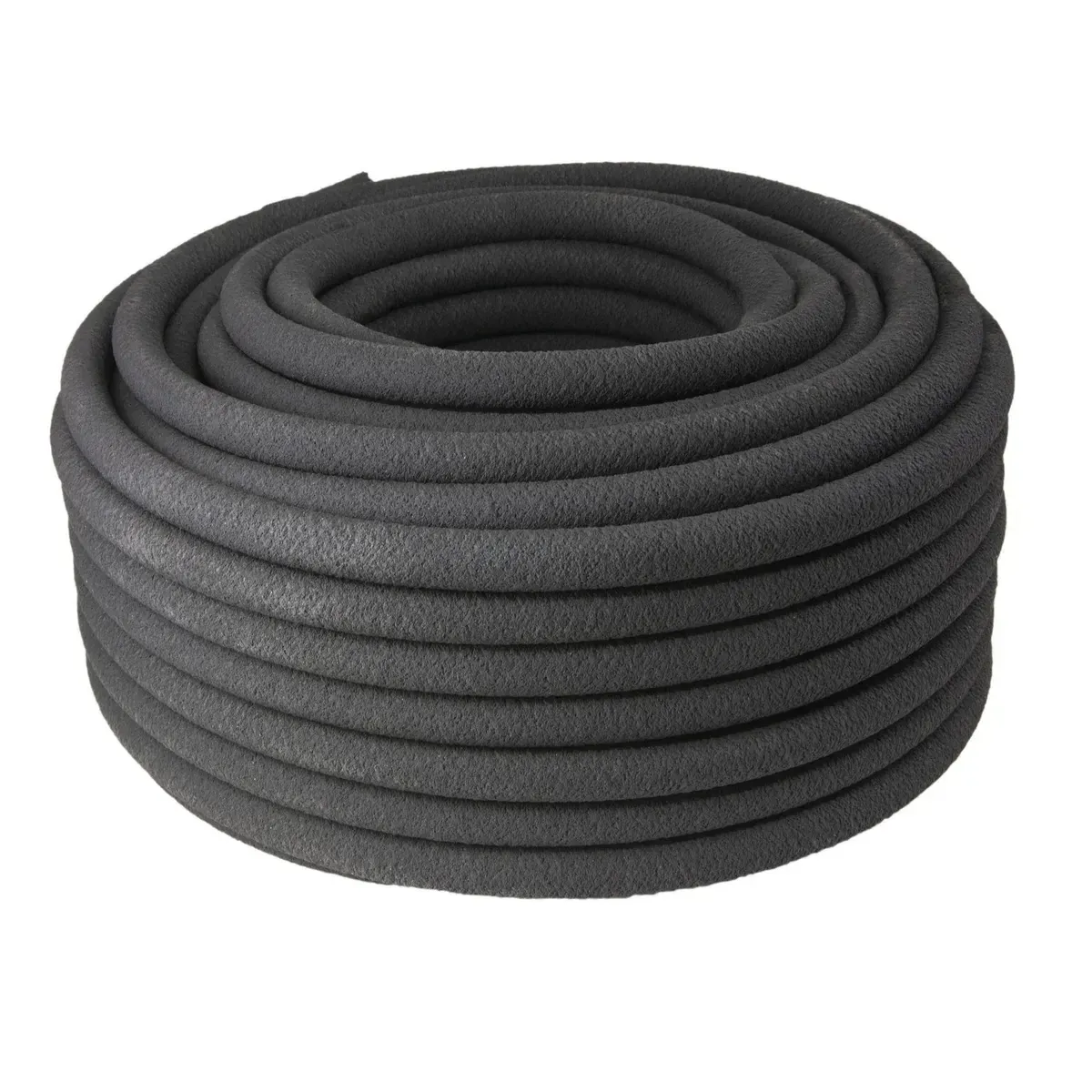 pitta 5/8 inch soaker hose laid through a landscaped planting area
